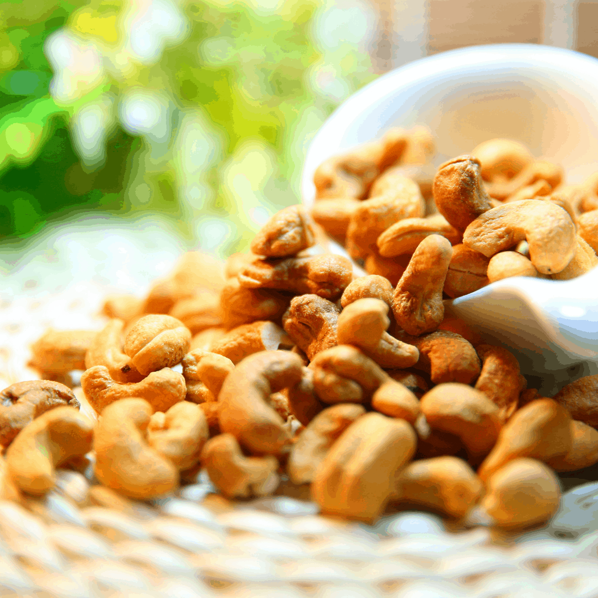 cashews being poured onto a table