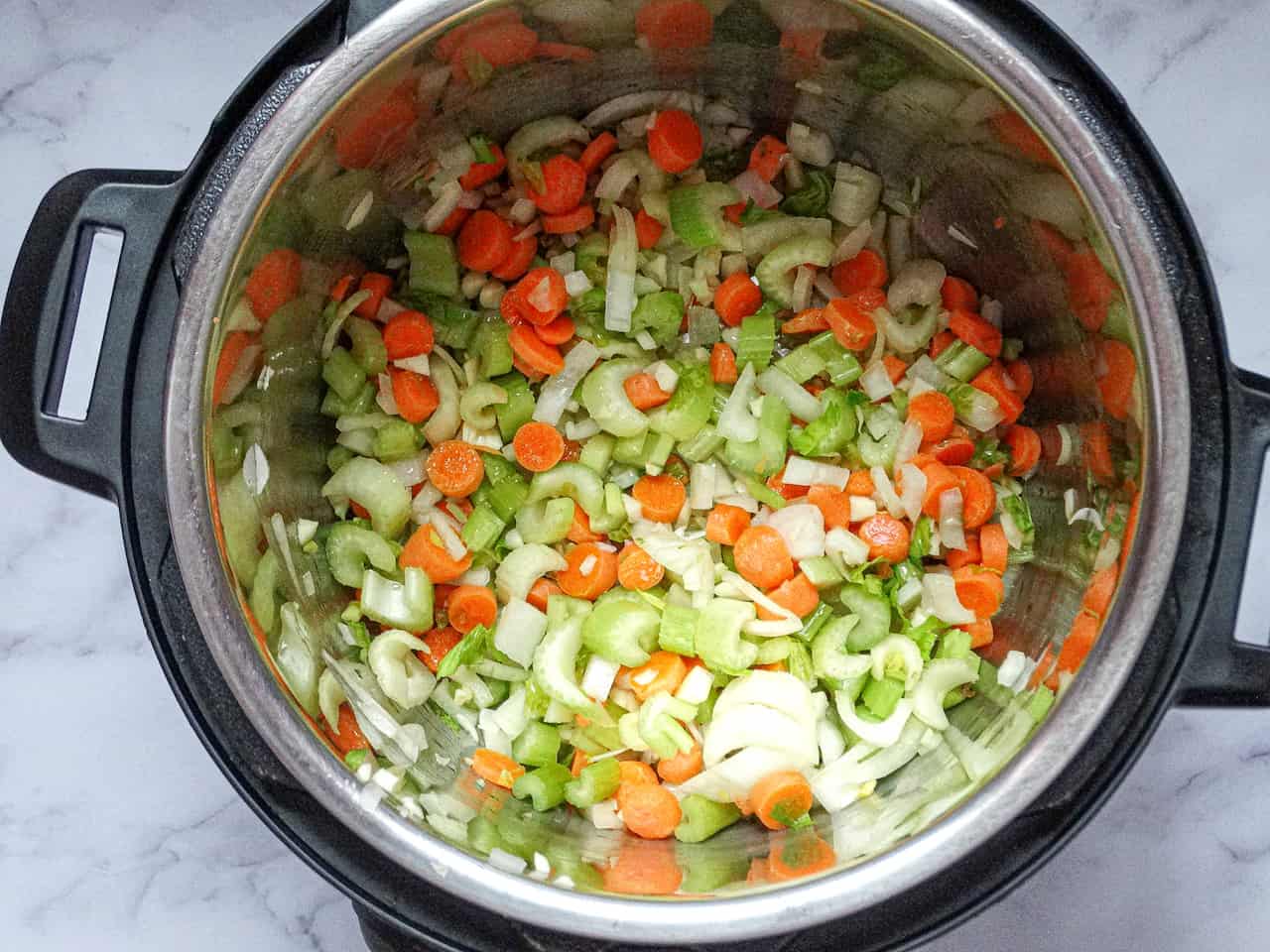 carrots, celery, onions, and garlic in an instant pot