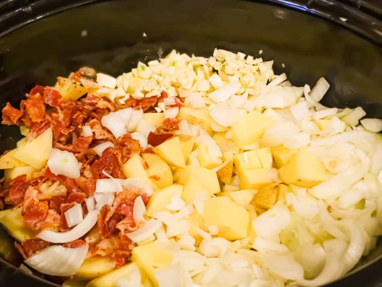 bacon, onions, garlic, potatoes and spices in a crock pot