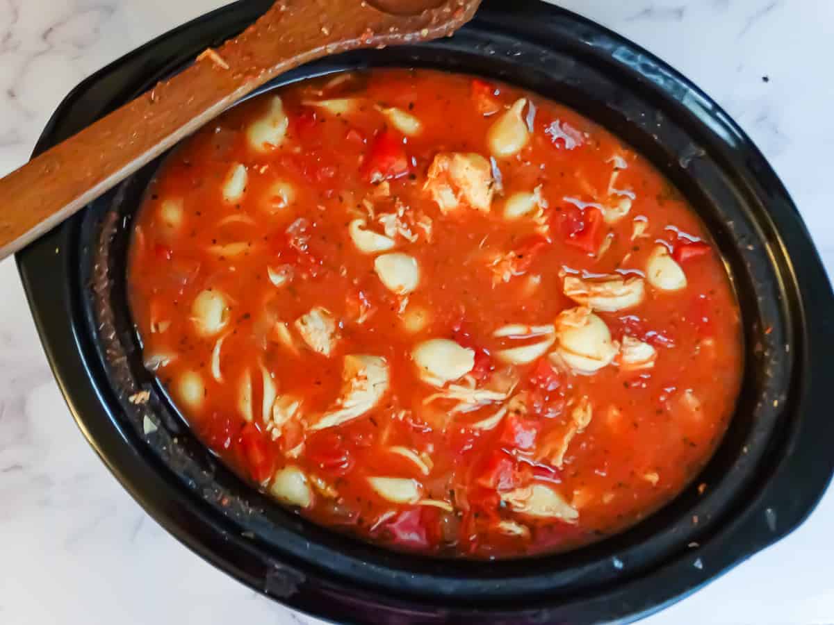 chicken parmesan soup with shell pasta in a crockpot