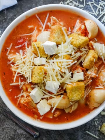 slow cooker chicken parmesan soup in a bowl