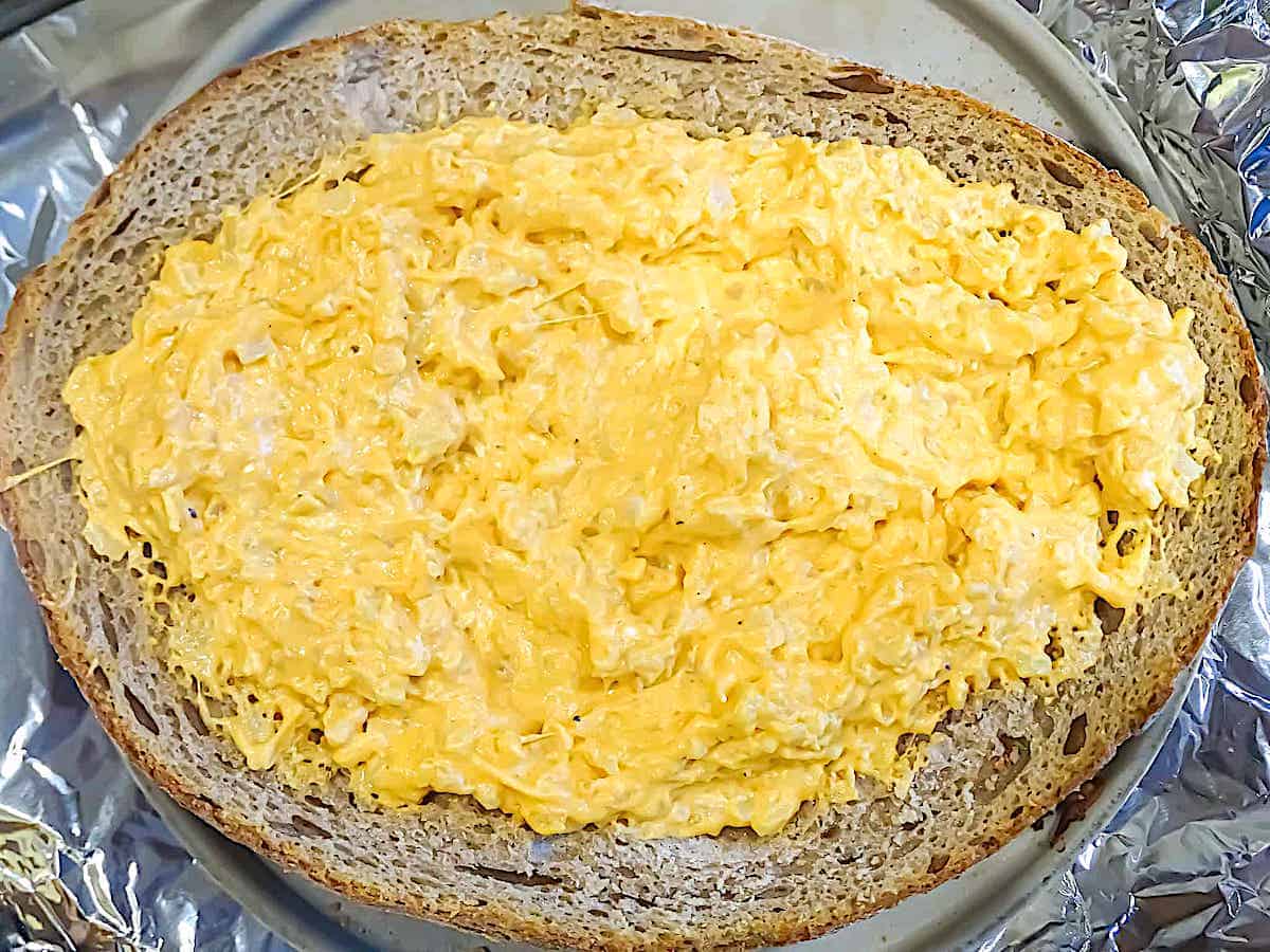 buffalo cauliflower dip in a bread bowl