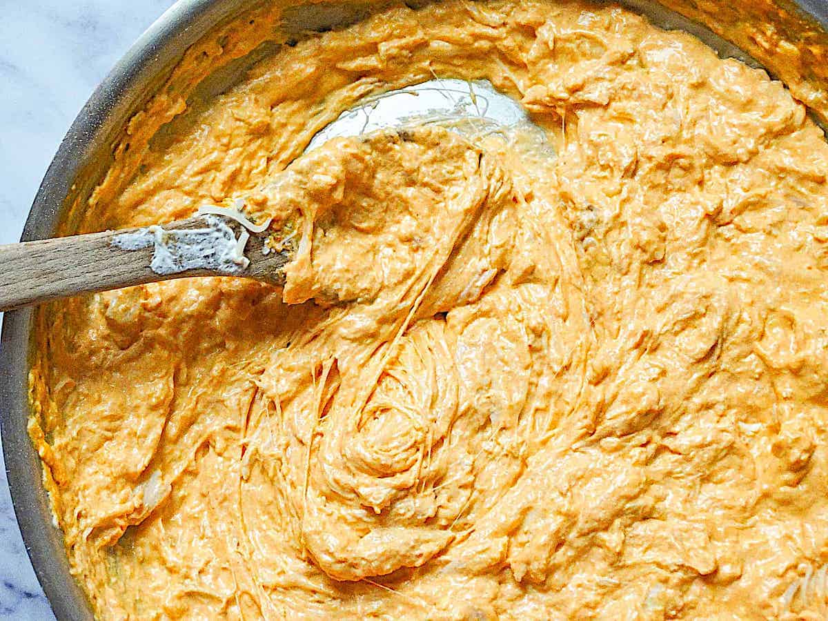 buffalo chicken dip sauteing in a pan on the stove