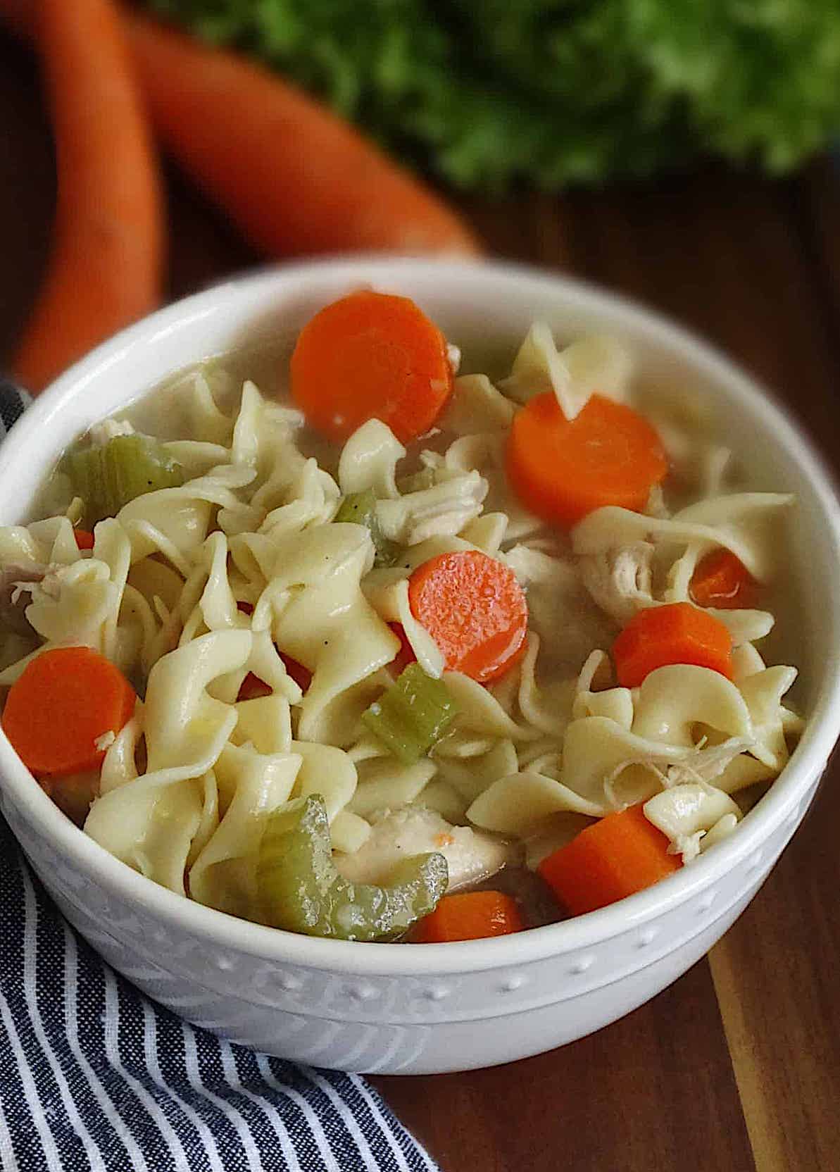 Chicken Noodle soup in a white bowl
