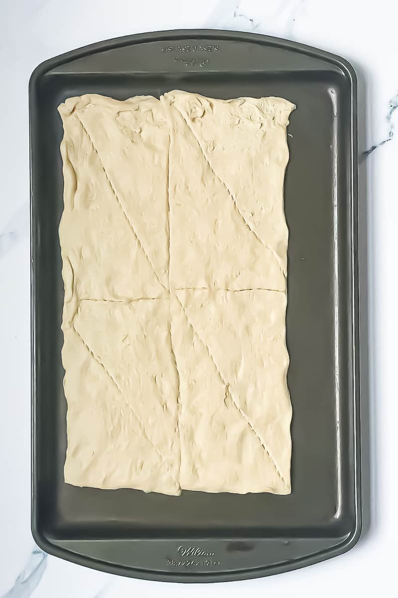 croissant rectangle spread onto a baking sheet