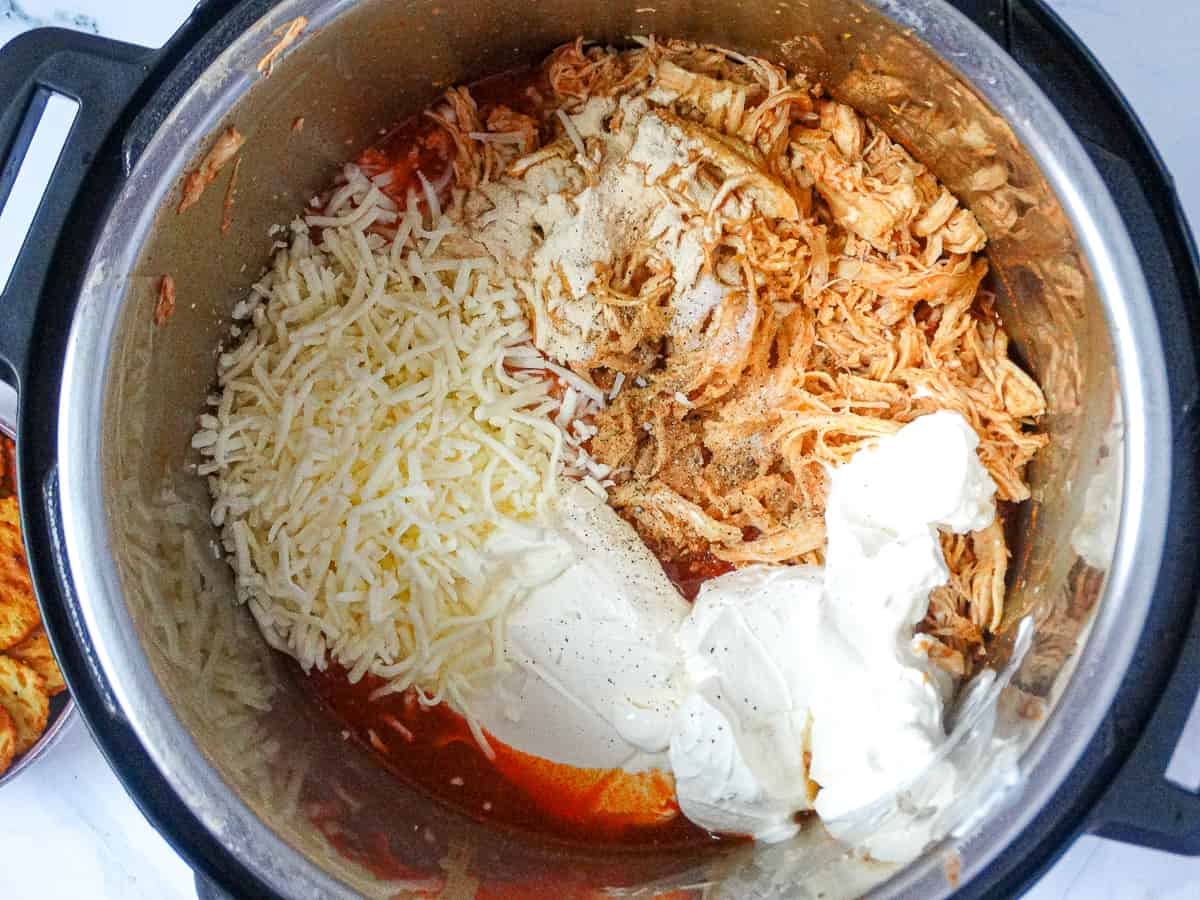 shredded chicken, mozzarella, cream cheese, and spices in the Instant Pot