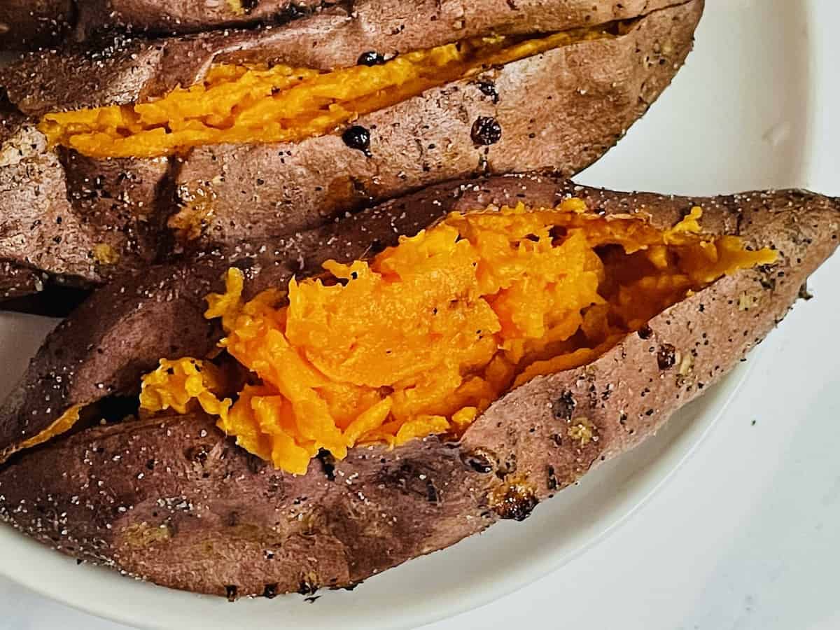 close up of 1 sweet potato on a white plate