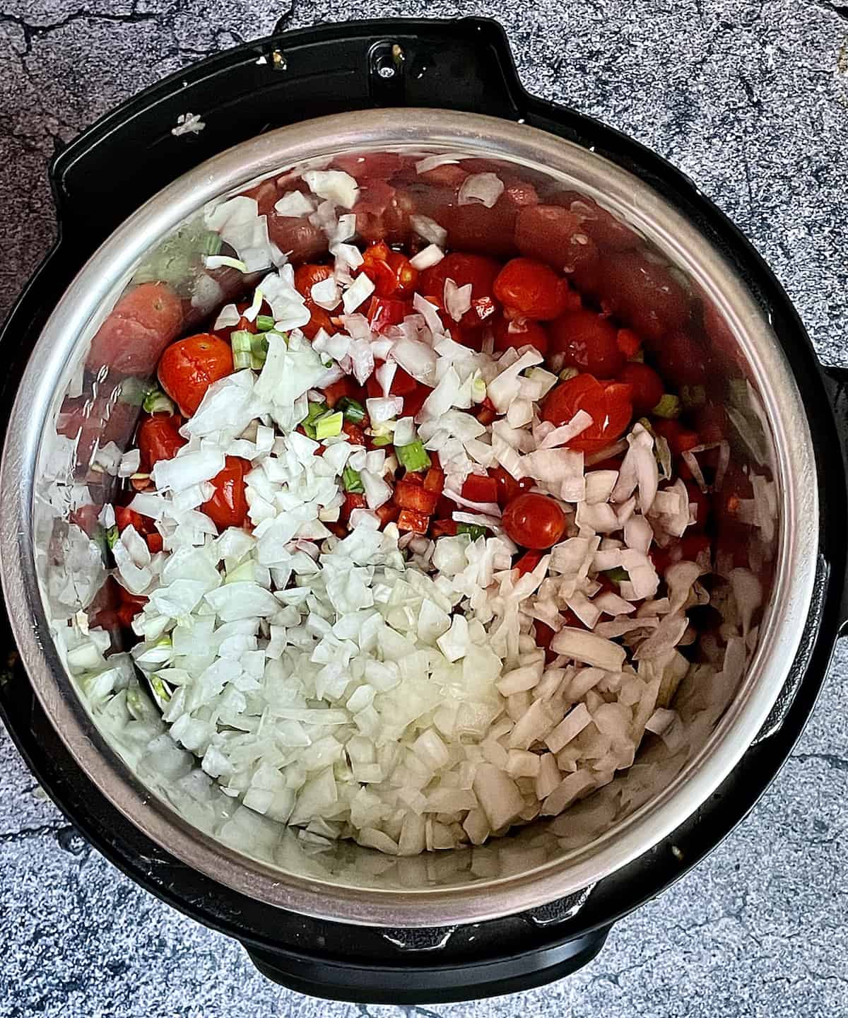 onion, peppers, tomatoes and garlic in an instant pot