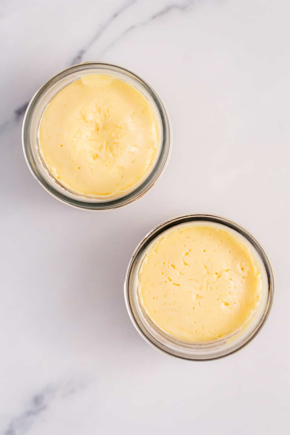 cooled instant pot mini cheesecakes in small mason jars