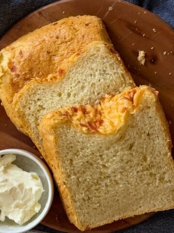 bread machine cheese bread on a cutting board