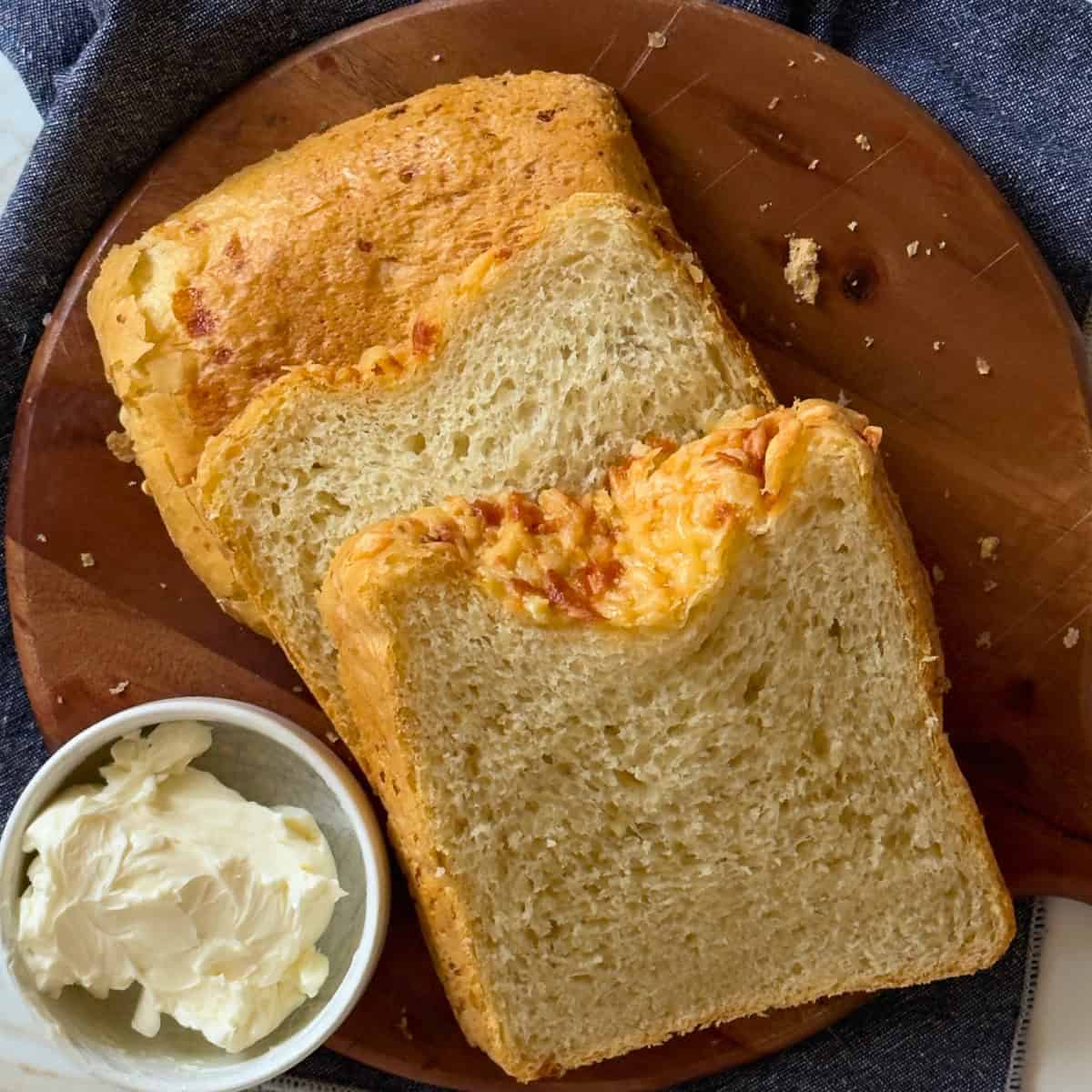 bread machine cheese bread on a cutting board