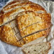 bread machine cheese bread sliced on a cloth