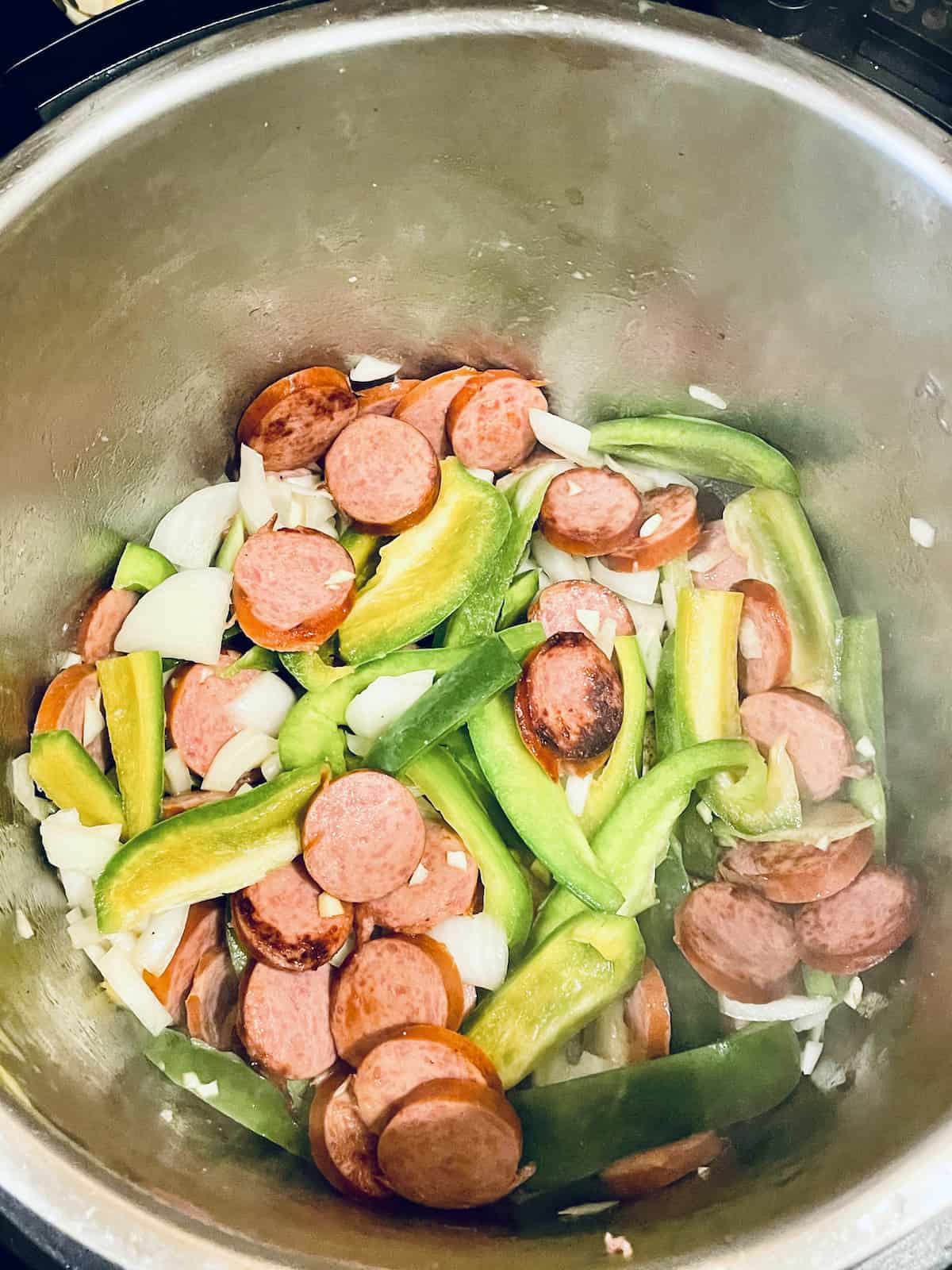 kielbasa, peppers, onions, and tomatoes in an Instant Pot