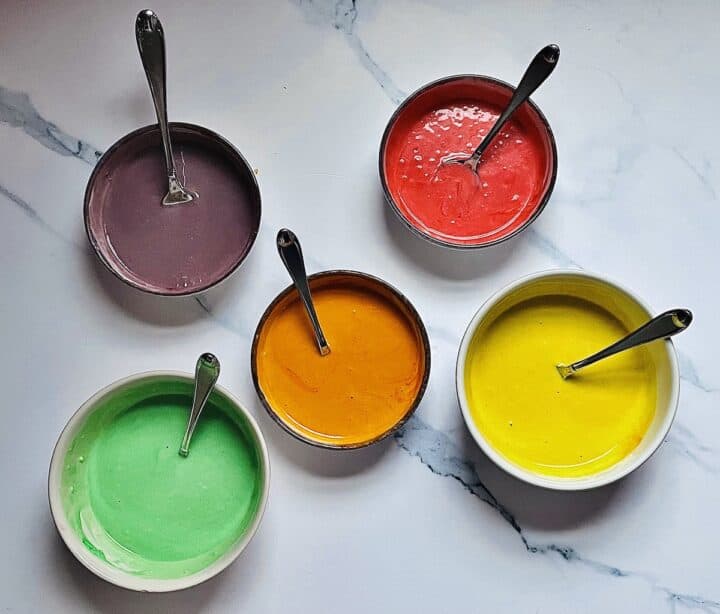 colored batter in separate bowls