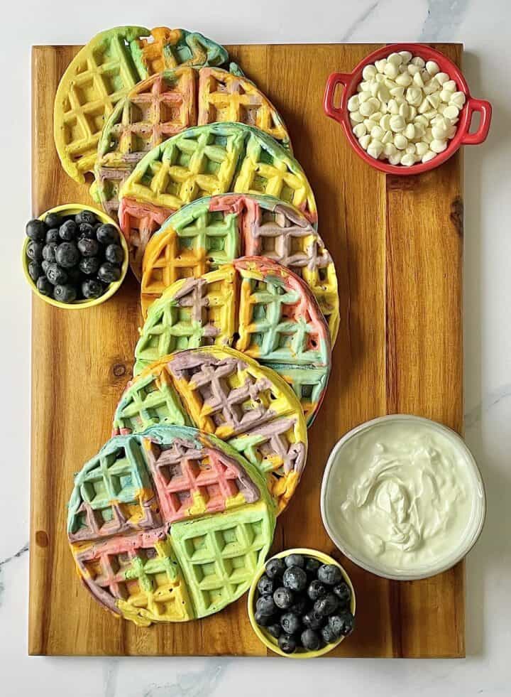 waffles, fruit, and yogurt on a charcuterie board