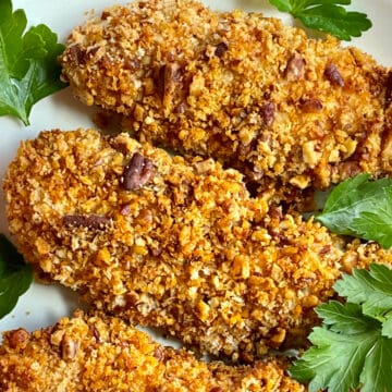 air fryer chicken tenders with a pecan crust on a plate