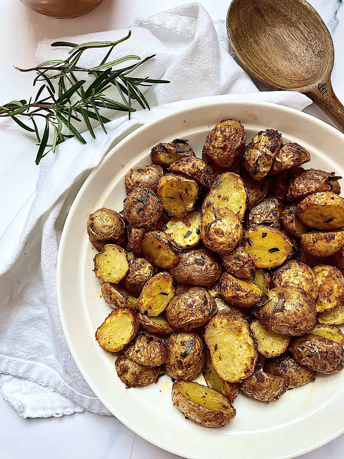 roasted baby potatoes in a white bowl