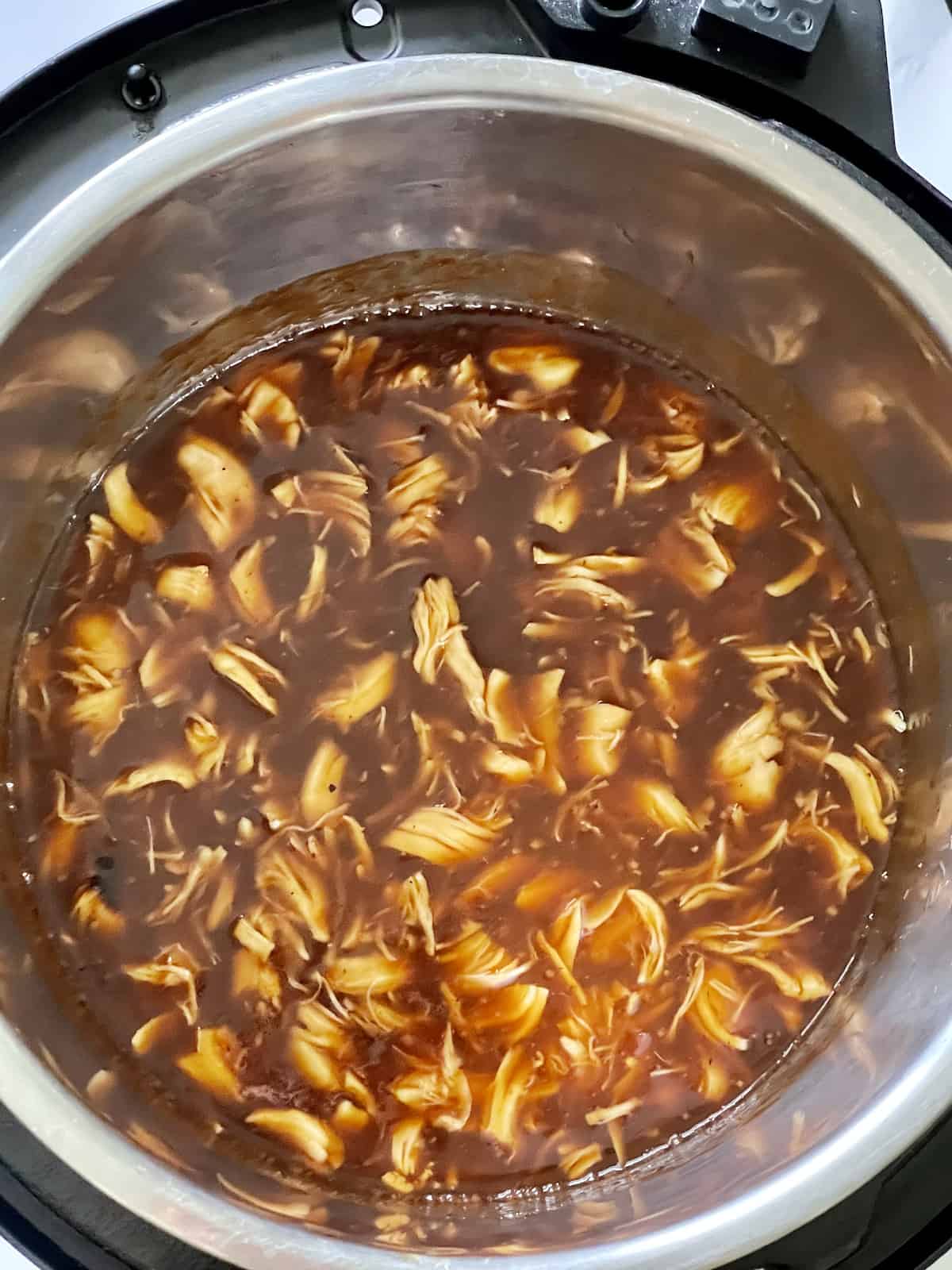 shredded barbecue chicken in a pressure cooker