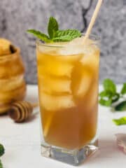 instant pot iced green tea in a cup with mint leaves