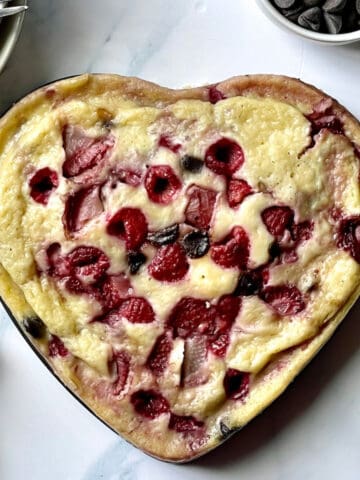 instant pot pancake with fruit and chocolate in a heart shape