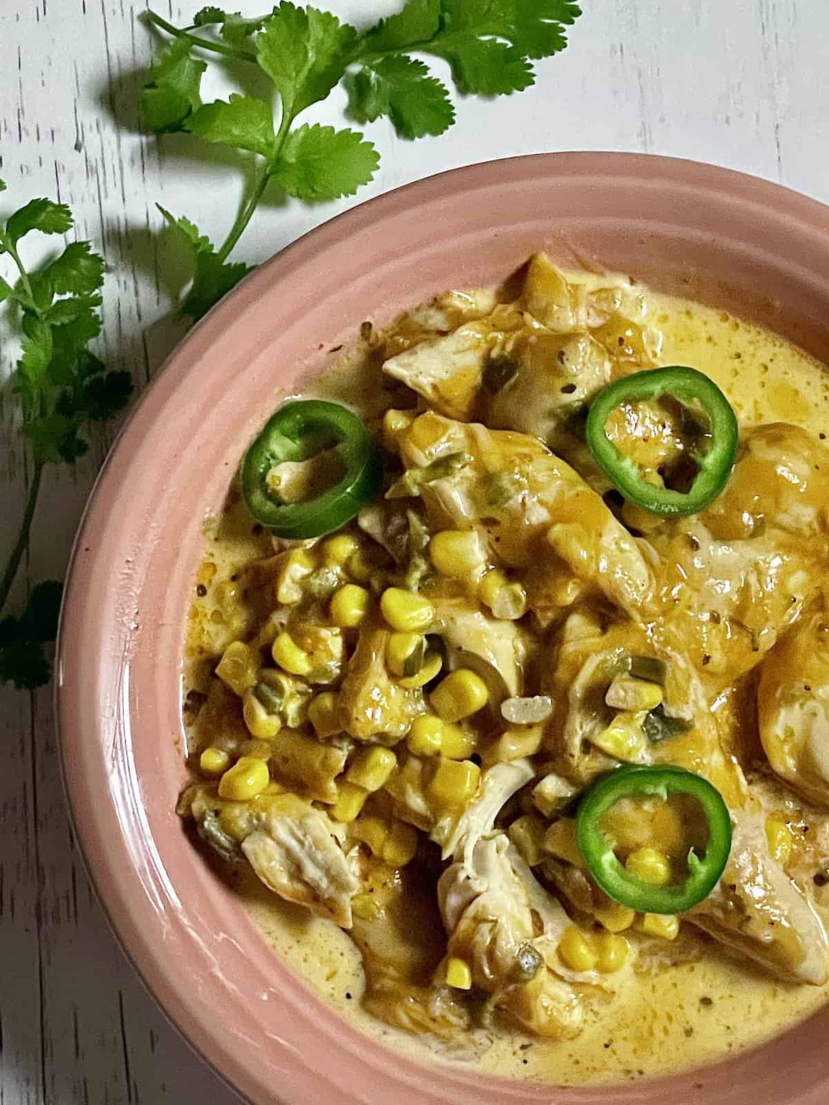 instant pot cheddar jalapeno chicken in a pink bowl