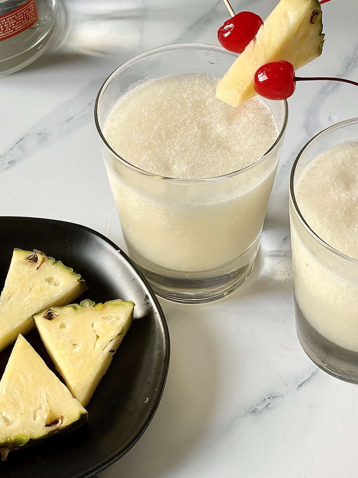 frozen pina colada in a small tumbler glass