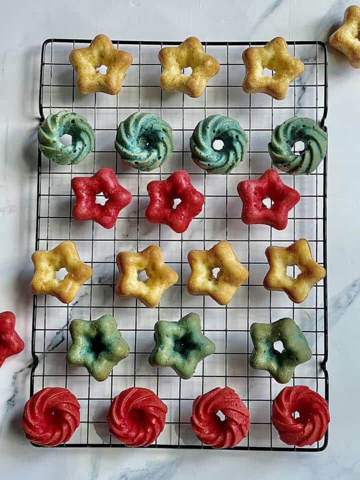 star shaped red white and blue mini cakes on a cooling rack