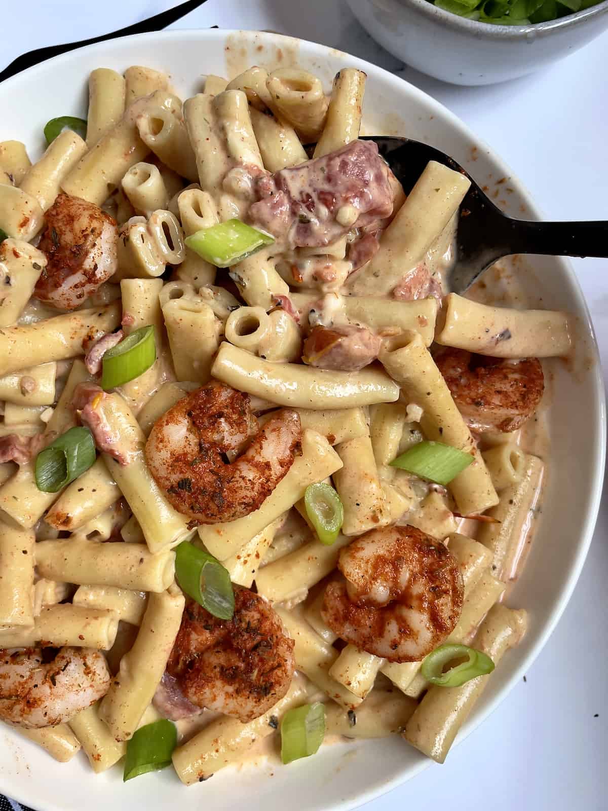 instant pot creamy cajun pasta in a white bowl