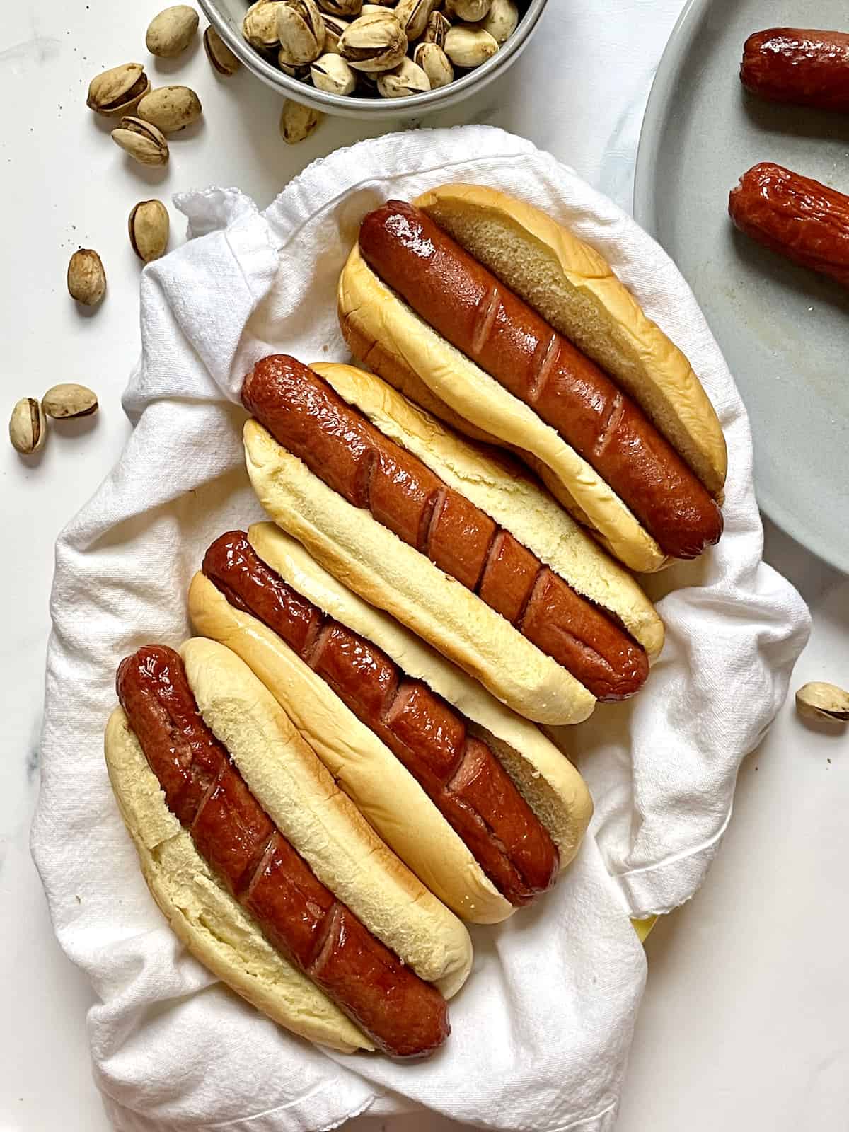 air fried hot dogs in buns in a basket
