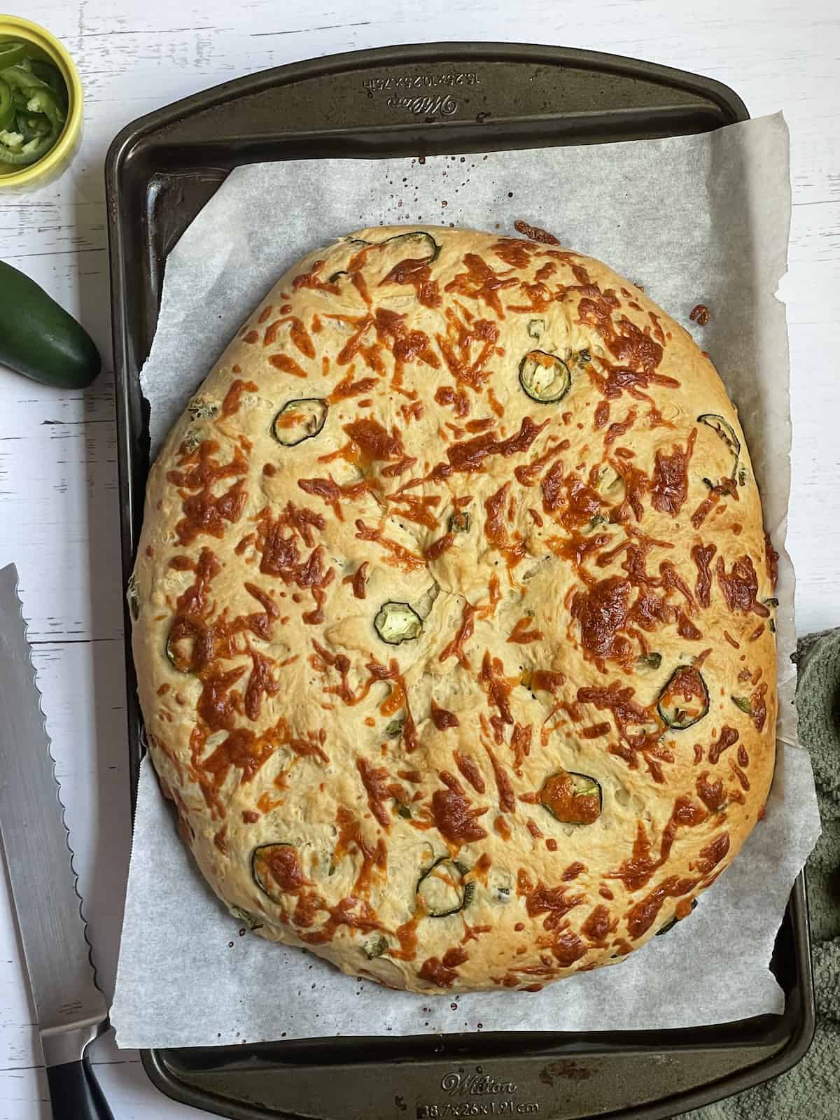 cooked cheddar jalapeno bread on a baking sheet