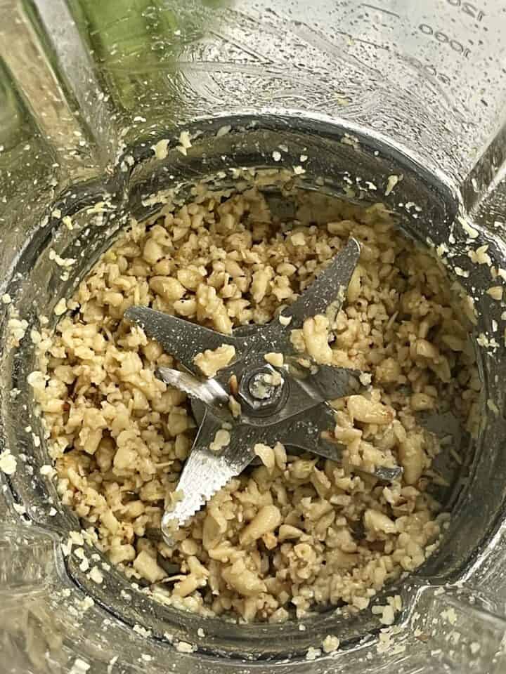 pine nuts crushed inside the cooking blender