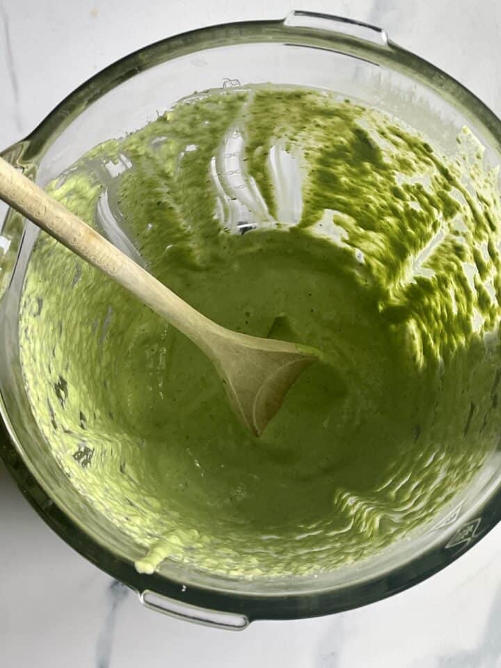 basil, pine nuts, and garlic in a blender processed