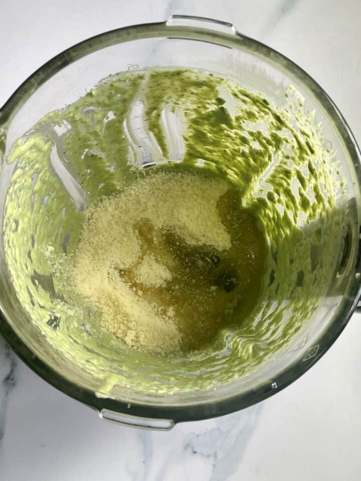 olive oil and parmesan cheese in a blender