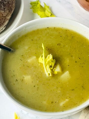 instant pot celery soup in a white bowl
