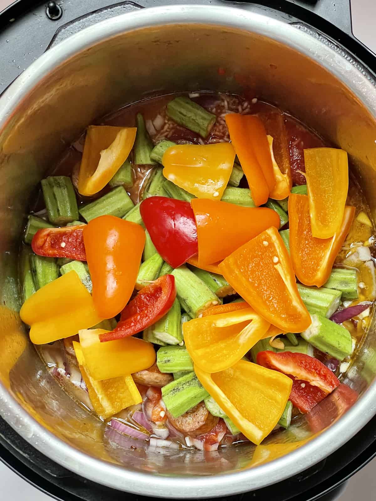 peppers, okra, and other ingredients in the instant pot