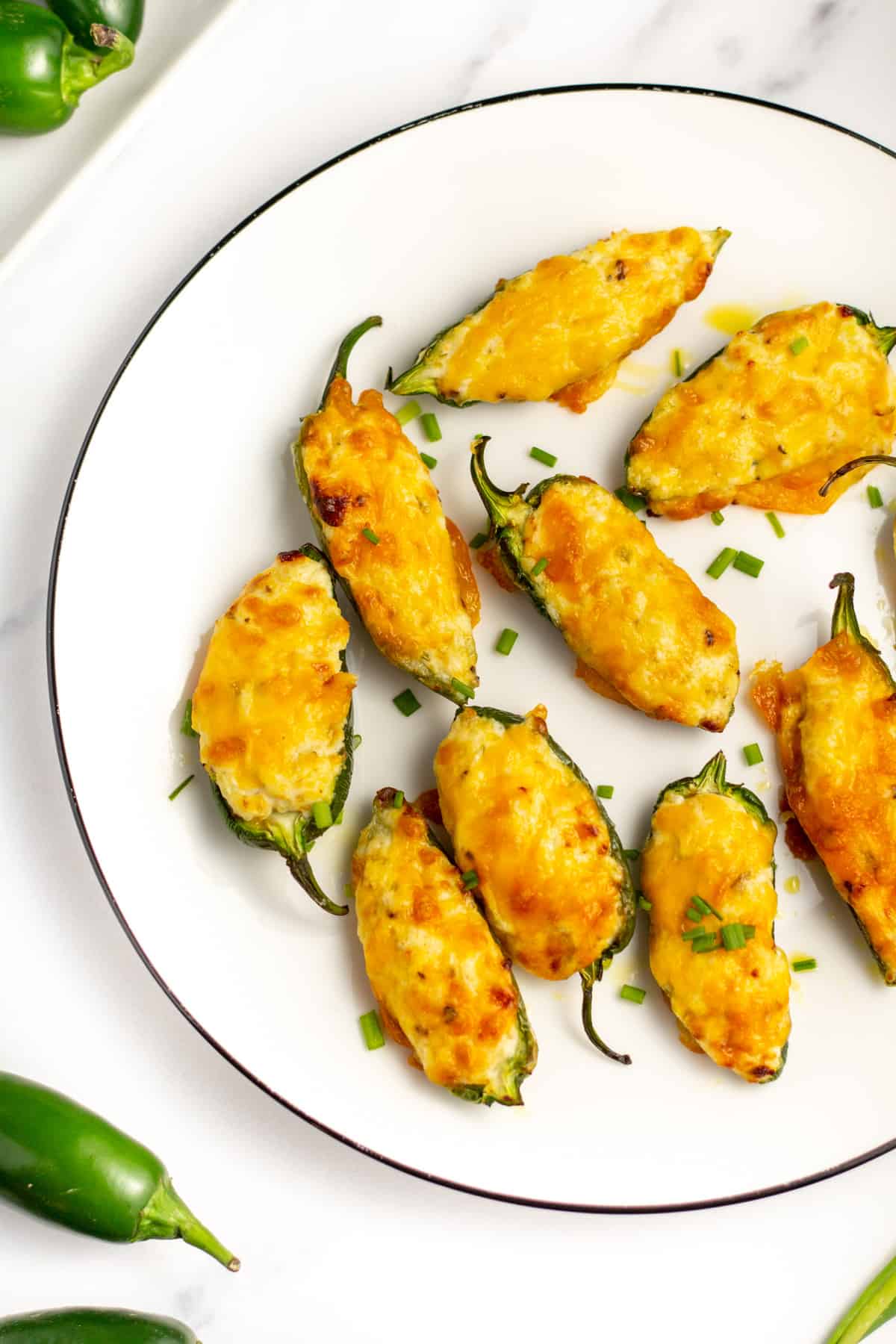 air fried jalapeño poppers on a white plate