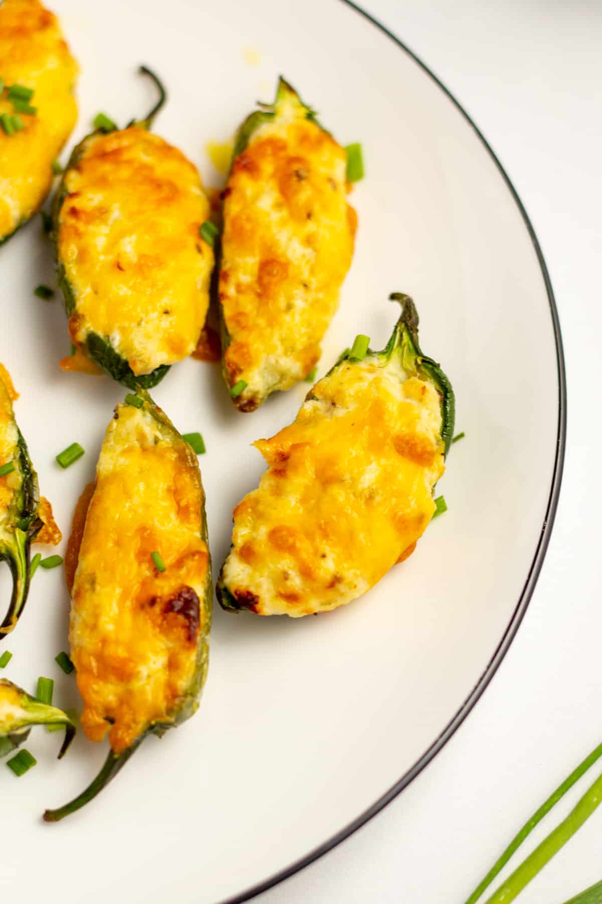 close up of golden brown cheesy jalapenos 