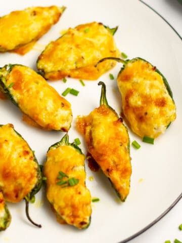 air fried cheesy jalapeno poppers on a white plate