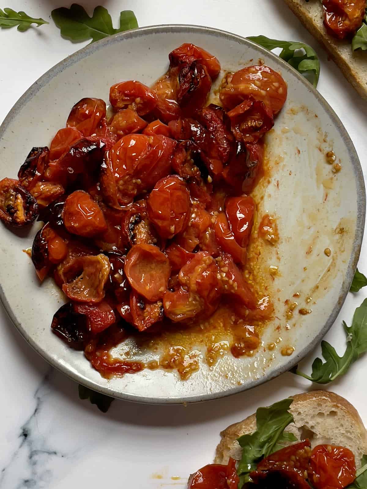 air fryer cherry tomatoes on a small plate