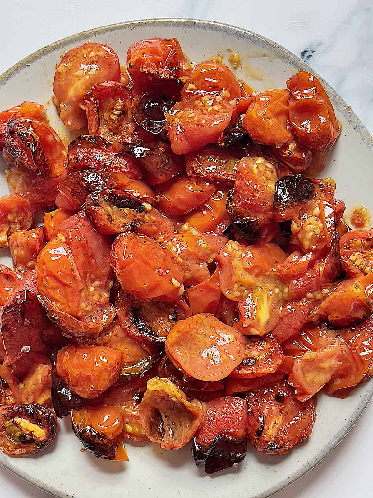 air fryer roasted cherry tomatoes on a plate