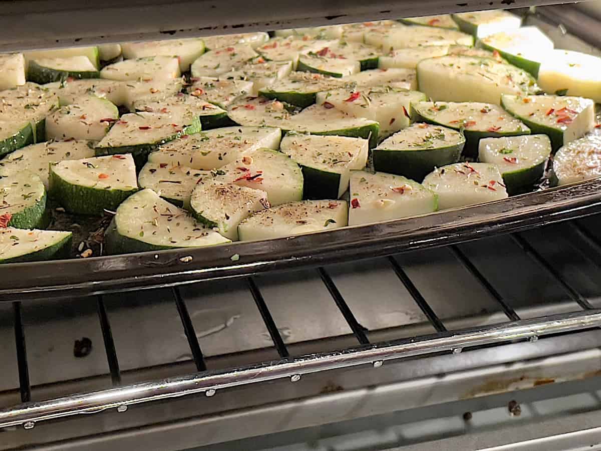 zucchini on a tray inside an air fryer