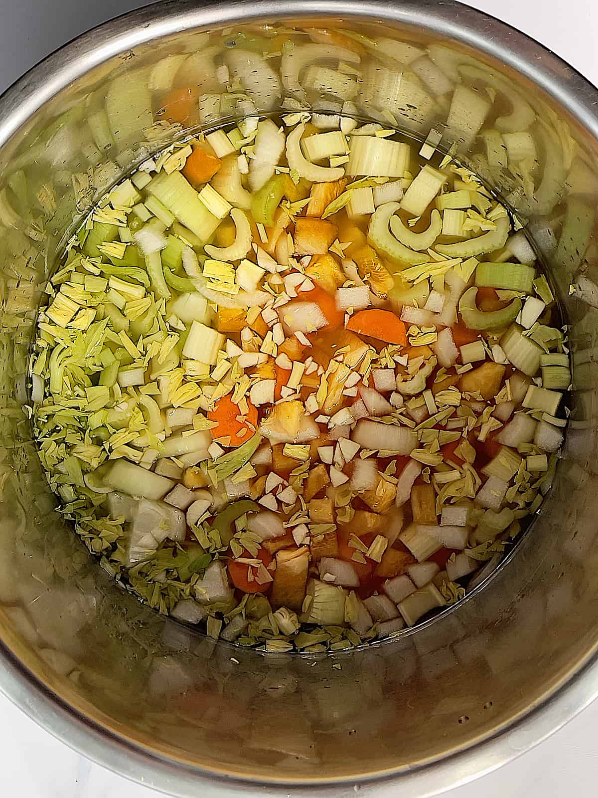 celery, cabbage, tomatoes, and carrots and broth in an instant pot