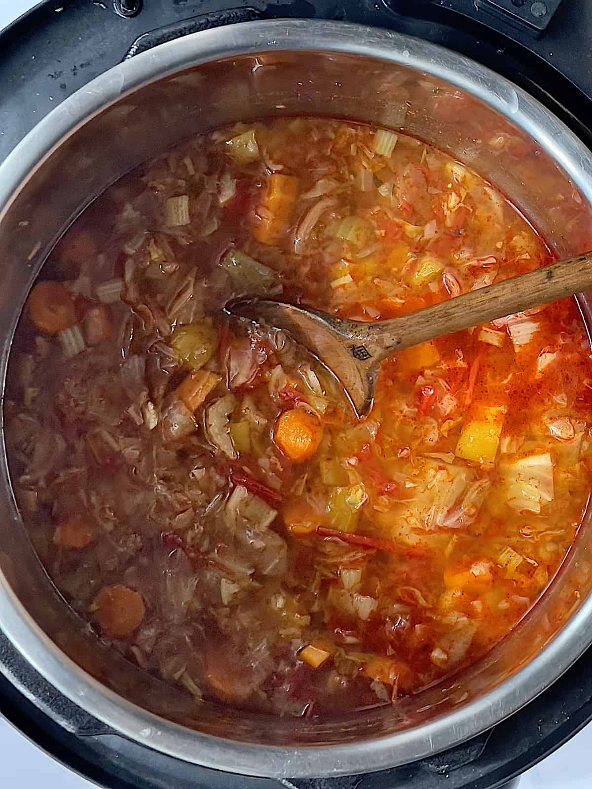 cooked instant pot cabbage soup in the inner pot mixed with a paprika roux