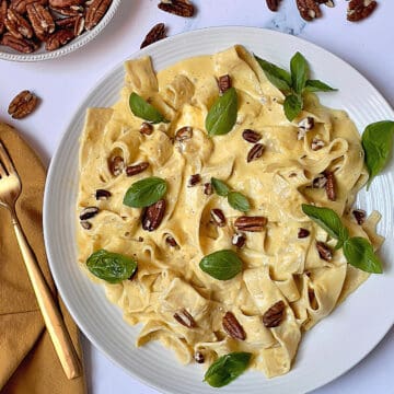 Instant Pot pumpkin pasta with pappardelle and topped with nuts and herbs