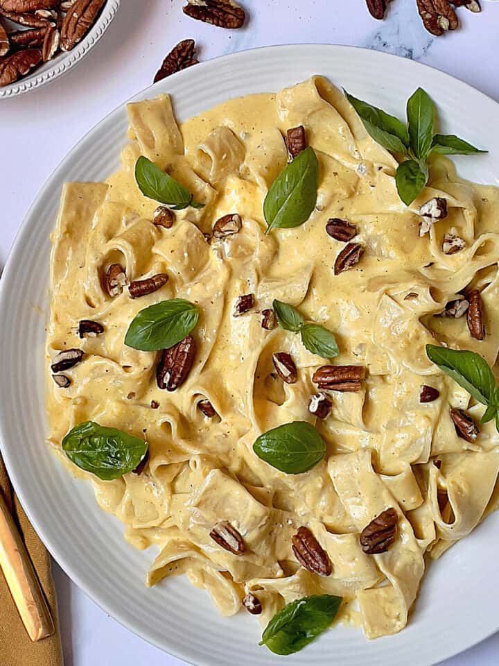 Instant Pot pumpkin pasta with pappardelle and topped with nuts and herbs