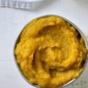 homemade pumpkin puree in a white bowl overhead picture