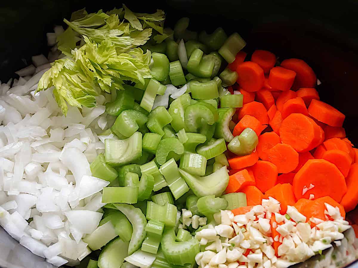 carrots, celery, garlic, and onions in a pot