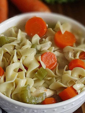 pressure cooker chicken noodle soup in a white bowl
