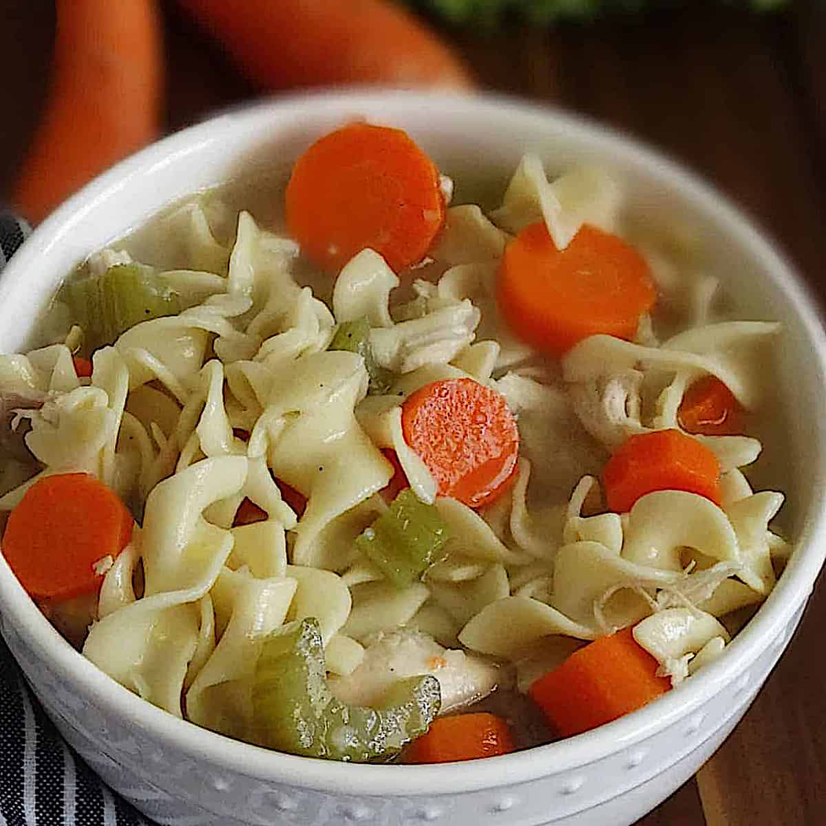 pressure cooker chicken noodle soup in a white bowl