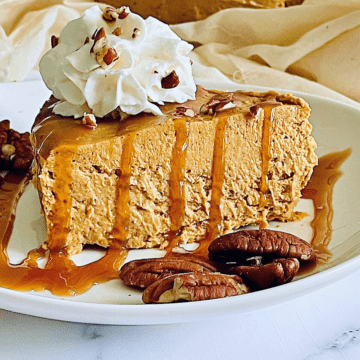 instant pot pumpkin cheese covered in caramel sauce and whipped cream